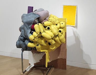 Jessica Stockholder, Kissing the Wall #5 with Yellow, 1990, chair, oil and latex and acrylic paint, fluorescent light, paper, glue, 30 x 36 x 54 inches (artwork © Jessica Stockholder, photograph © Clements Photography and Design, Boston)