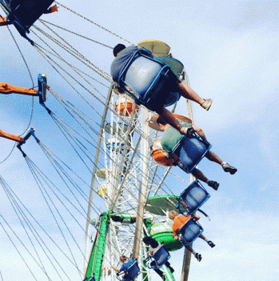 Swings and a Ferris wheel in Cape Cod, Massachusetts (photograph © Matthew Israel)
