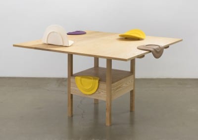 Shana Lutker, As Many Versions as Witnesses, no. 1, 2015, wood (ash), table position: 29 x 51 x 51 in, (73.6 x 129.5 x 129.5 cm), chair position: 64 x 51 x 21 in. (162.5 x 129.5 x 53.3 cm) and Shana Lutker, Ambassadors or Poets, 2015, ceramic, dimensions variable (artworks © Shana Lutker; photograph by Robert Wedermeyer)