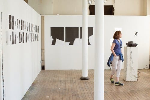 A visitor in Marco Breuer’s studio during the Spring 2016 Open House at Headlands Center for the Arts (artwork © Marco Breuer; photograph by Andria Lo, provided Headlands Center for the Arts)