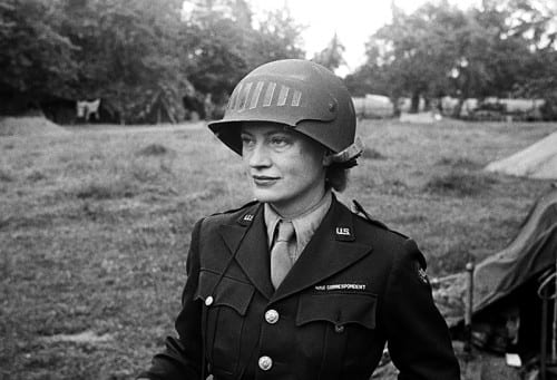 Unknown photographer, Lee Miller in steel helmet specially designed for using a camera, Normandy, France 1944, black-and-white photograph (photograph © The Penrose Collection, England 2016, all rights reserved, www.leemiller.co.uk)