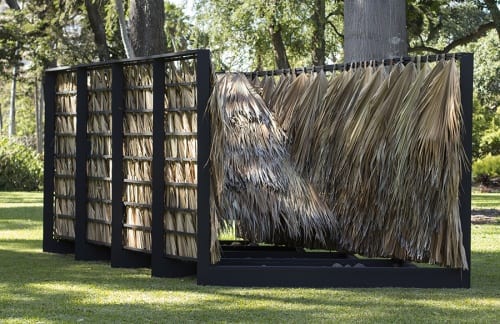 Sean Connelly, Thatch Assembly with Rocks (2060s), 2017, wood, palm, rock, 10 x 16 x 8.8 ft. (3.04 x 4.87 x 2.68 m), front view  (artwork © Sean Connelly; photograph © Sean Connelly)