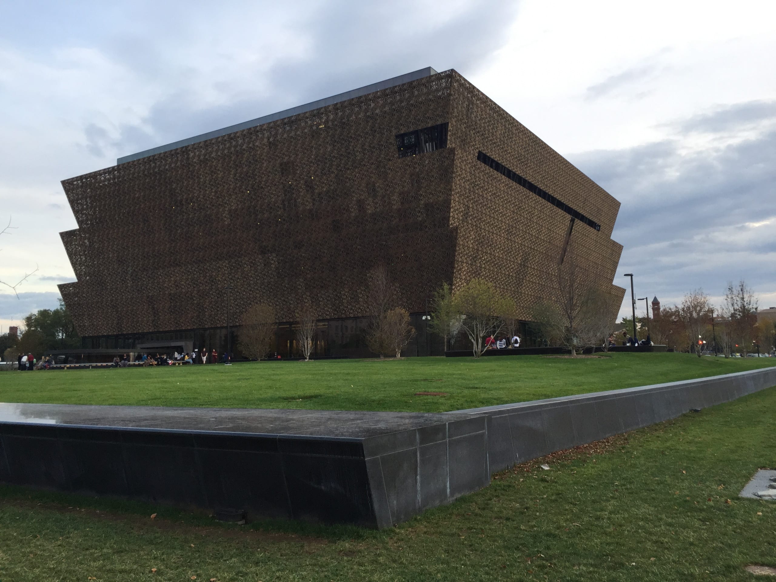 View of the NMAAHC building , showing the metal screen cladding of the exterior