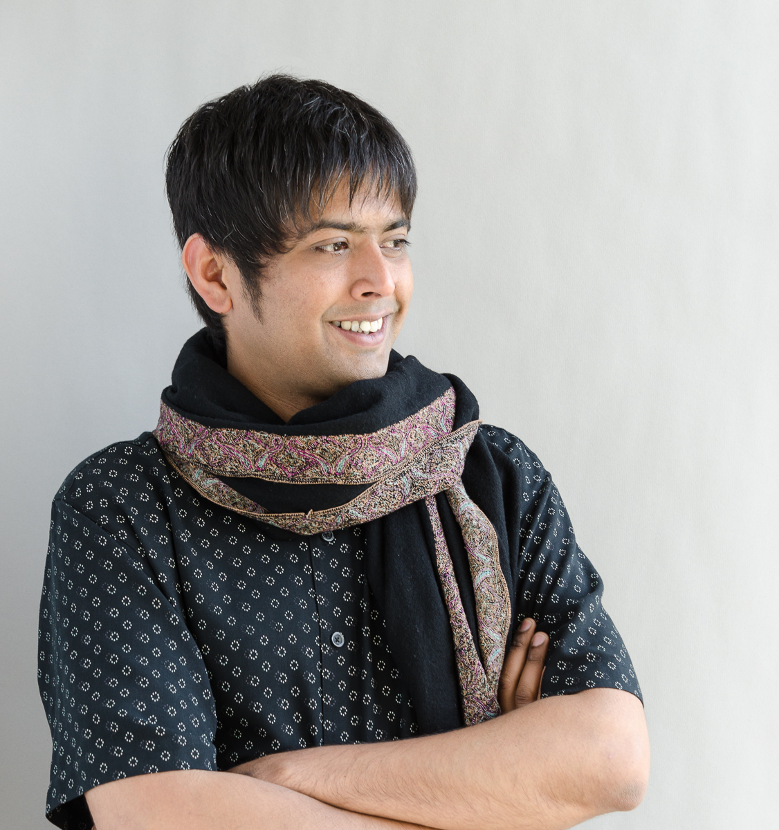 Color photograph of Sugata Ray, smiling and looking off into the distance