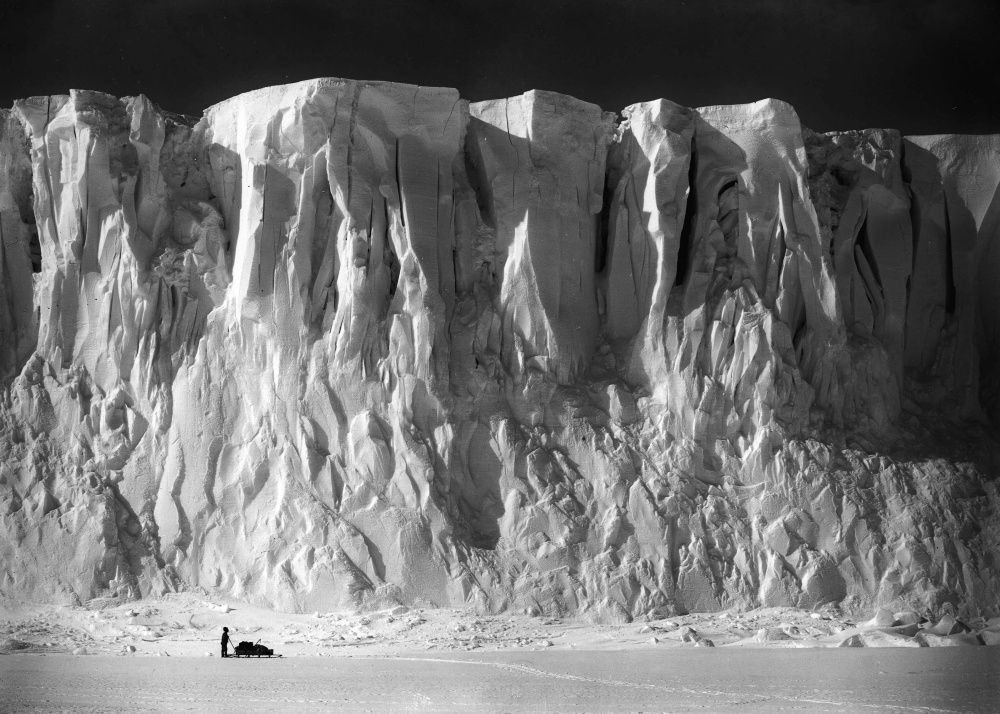 Anton Omelchencko stands at the end of the Barne Glacier on Ross Island, in the Ross Dependency of Antarctica, during Captain Robert Falcon Scott’s Terra Nova Expedition to the Antarctic, December 2, 1911.