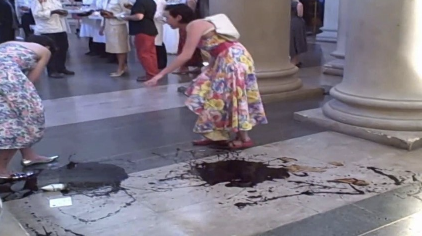 Video still of anti-fossil fuel activists in London spilling “oil” at the Tate Britain gallery’s summer party, during the performance piece License to Spill, 2010.