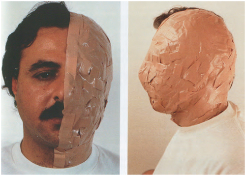 Portriat of a man in frontal and profile view. 2 panels forming a diptych. Left panel: Front view. half of face exposed, half covered in band aid. Right panel: Profile view of the half face covered in band aid. The standard skin color of the band aid is lighter than the man's actual dark skin.