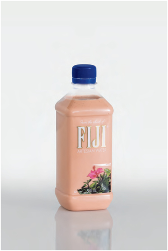 A plastic FIJI bottle filled with a beige colored substance. The bottle is reflected in the surface it stands on. White background.