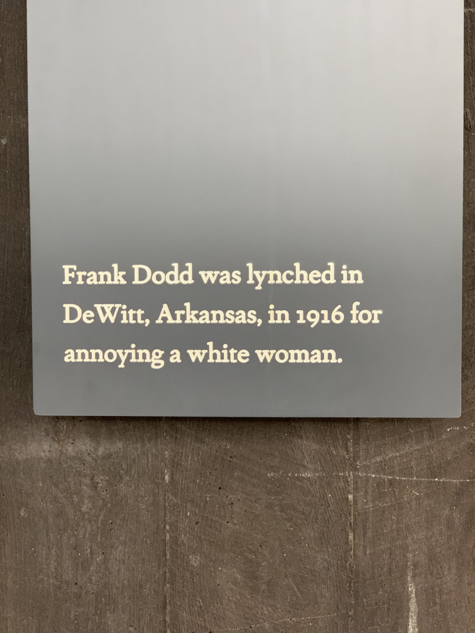 label reading "Frank Dodd was lynched in DeWitt, Arkansas, in 1916 for annoying a white woman"