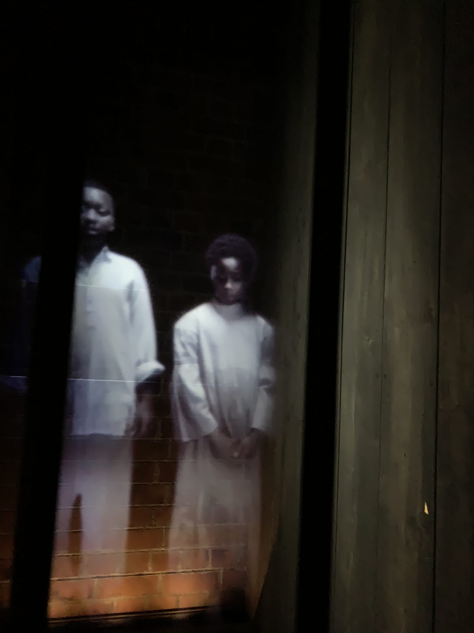 opening installations of holograms with voices speaking accounts of slaves in holding cells before auction