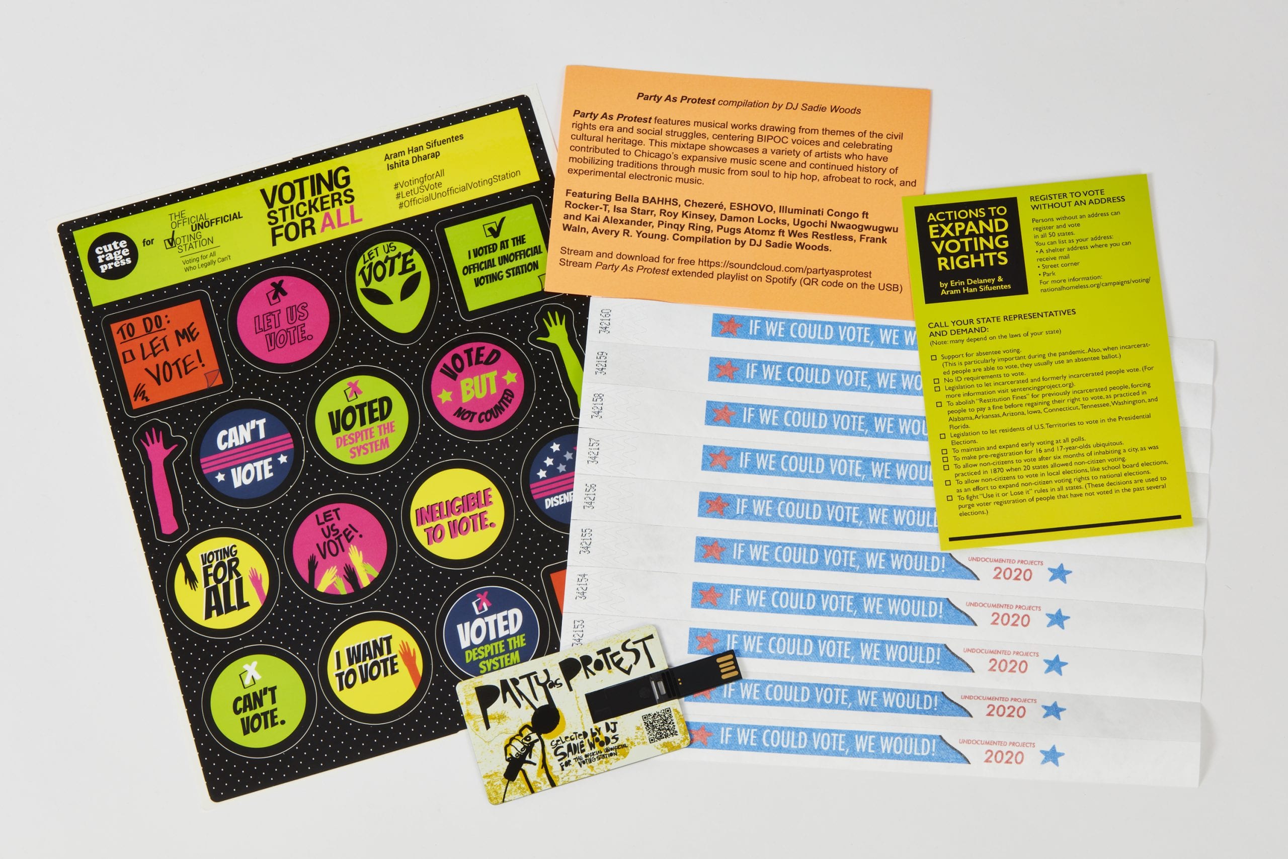 Colorful branded stickers and wristbands, a USB stick with music, and "Expand Voting Rights" flyers