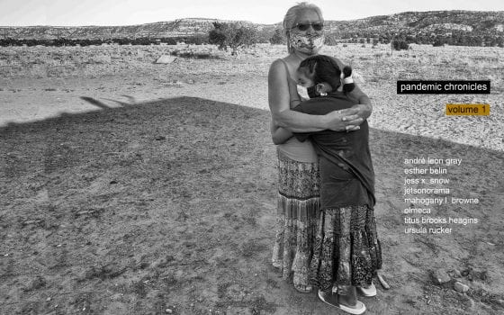 Black-and-white photograph of an older woman and a child embracing one another; both are standing outside and wearing handmade cloth face masks. The title of the zine and the name of all contributors is superimposed over the image.